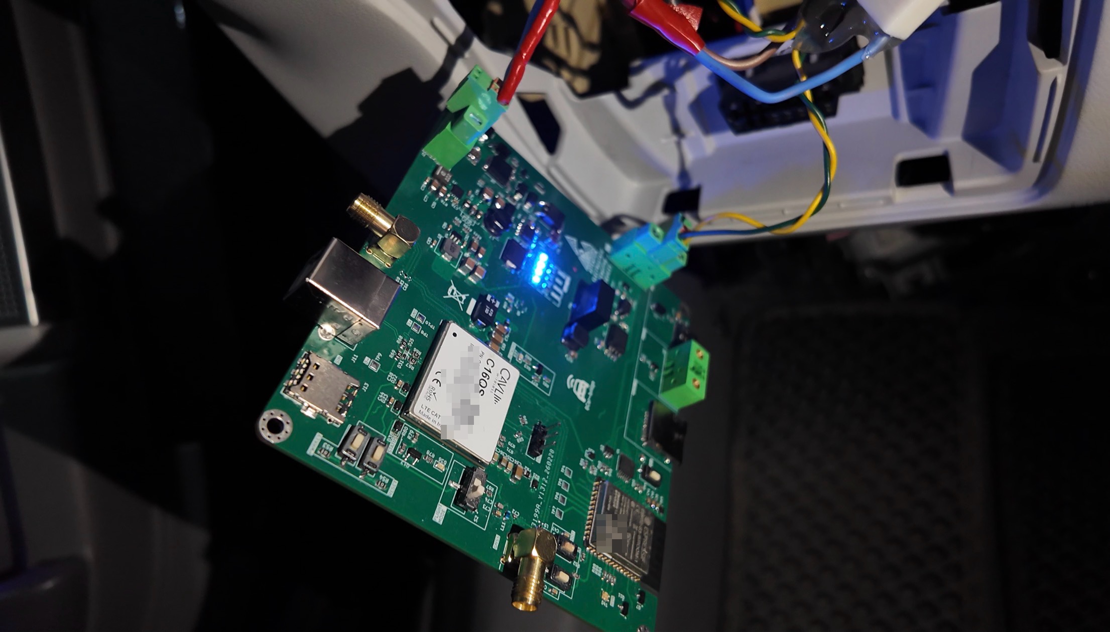 The BCar bridge board installed in the car, wired directly to the B-CAN bus, LEDs on